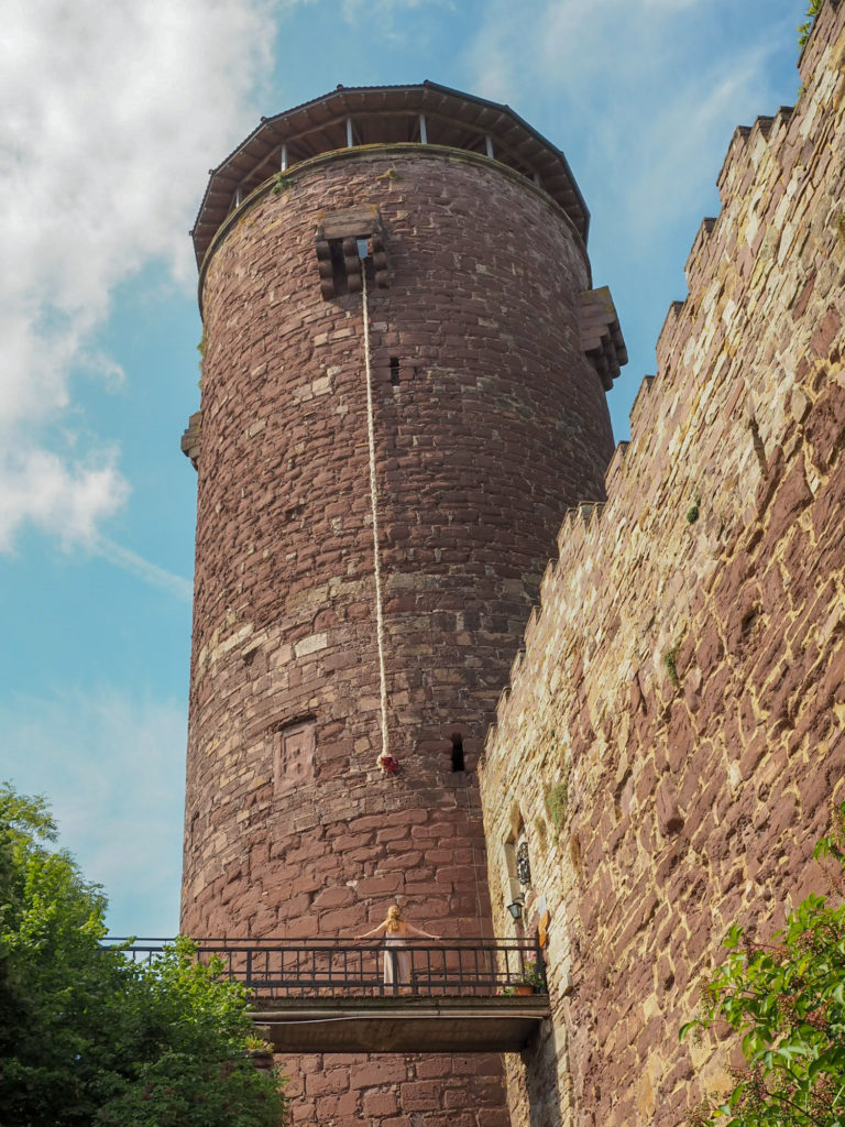 The Trendelburg Tower, Germany, with Rapuzel's 'hair' (braided rope) hanging down
