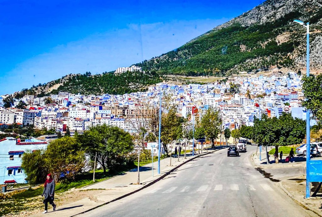 View of the hillside blue city of Chefchaoun, Morocco, as seen from the approach road