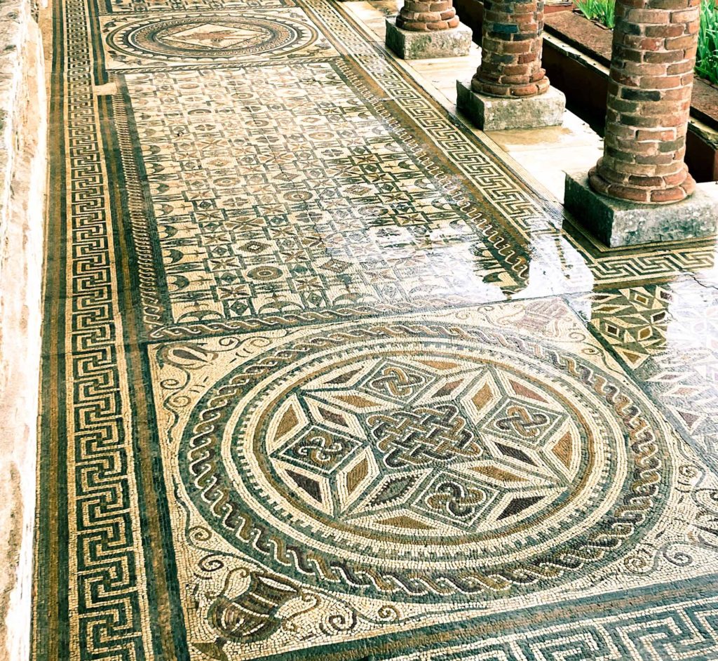 Attractive and well preserved, patterned stone floor mosaic, at the Roman city of Conímbriga, Portugal
