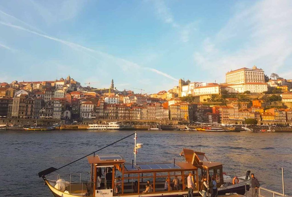 Looking across the river in Porto, with a riverboat taxi loading passengers ready to cross the river