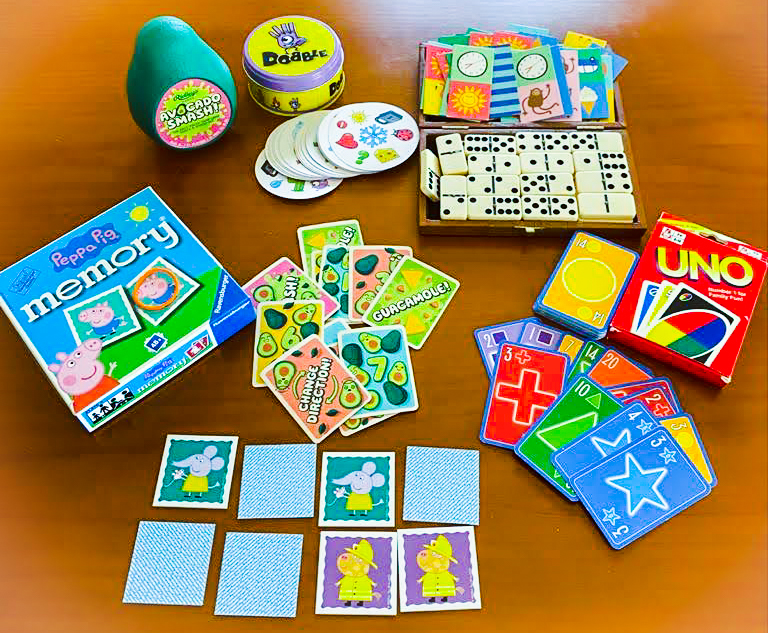 Selection of children's games, spread out on a table