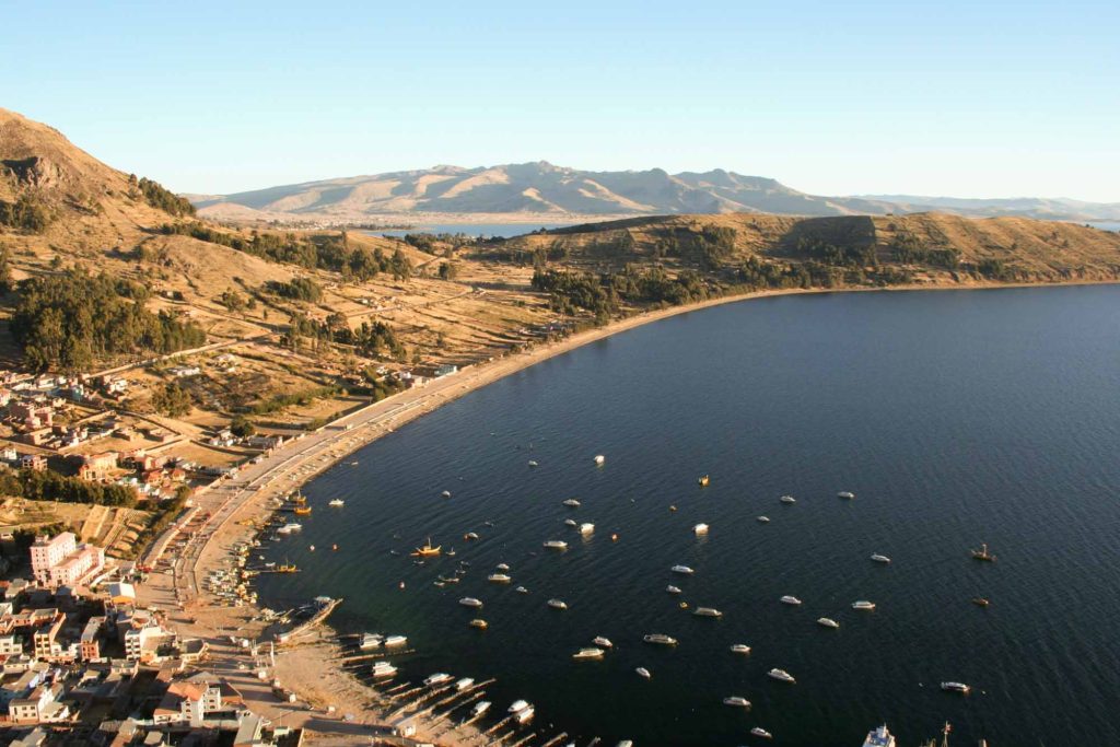 View from high looking down on the coastal bay with boats, at Copacabana, Lake Titicaca