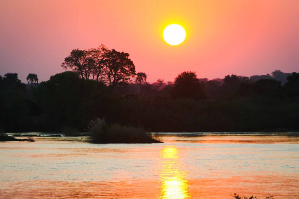 Red sunset reflected in the River Zambezi, Zambia