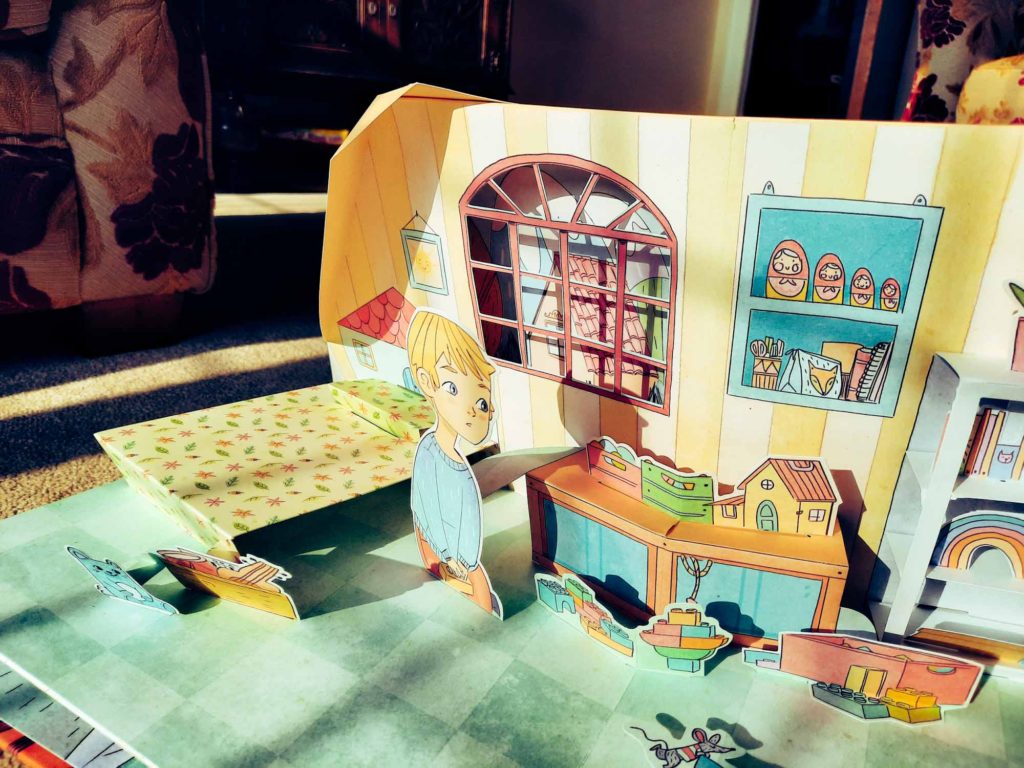 Close up of a bedroom scene in a child's pop-up book