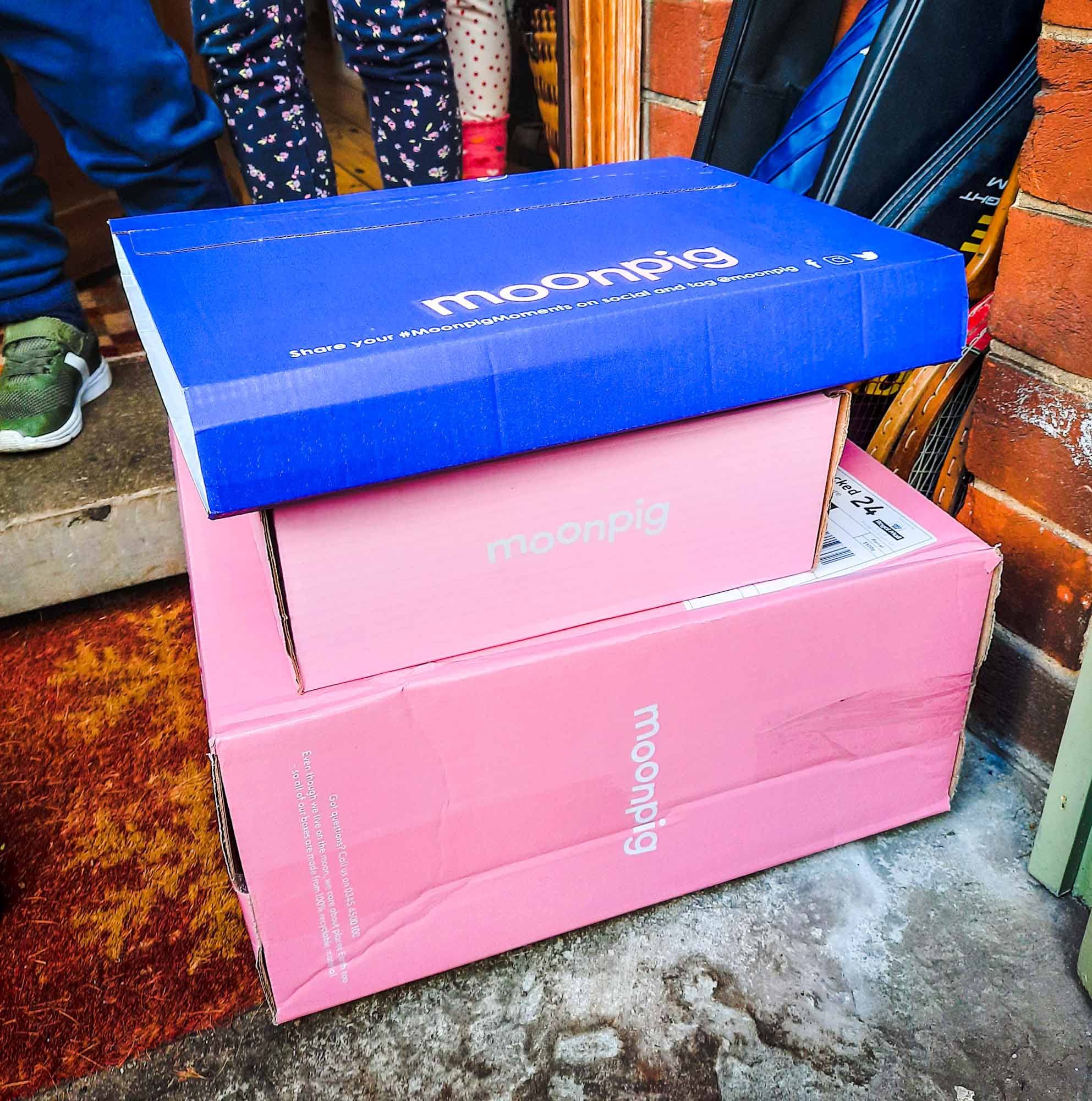 Pile of parcels on a doorstep, from Moonpig