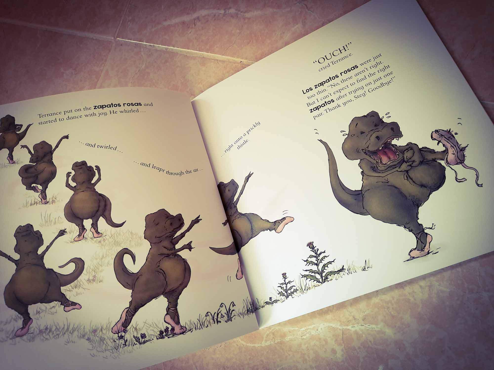Inside page view of a children's language learning book, showing a dancing dinosaur