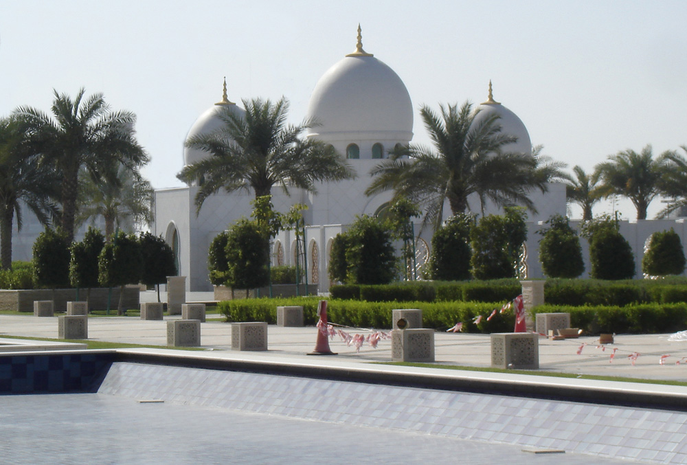 Formal gardens outside the Abu Dhabi Grand Mosque, with whitewashed mosque behind