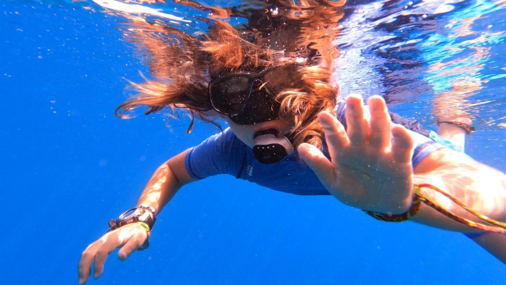 Underwater view of a child snorkelling