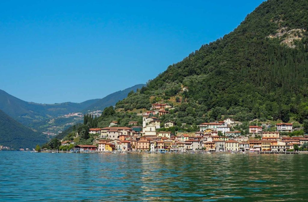 View from a boat of a lakeside village in northern Italy