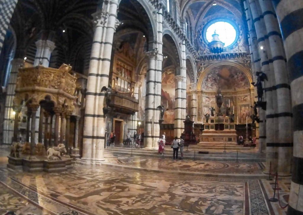 Elaborate cathedral interior decorated with black and white marble