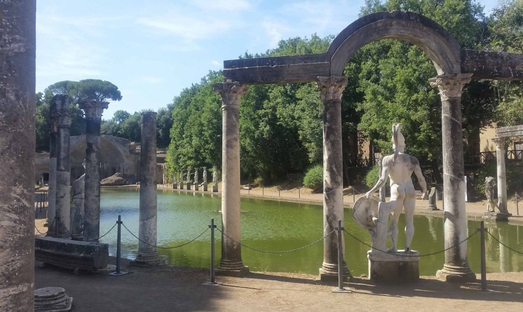 Decorative lake surrounded by Roman columns and statues